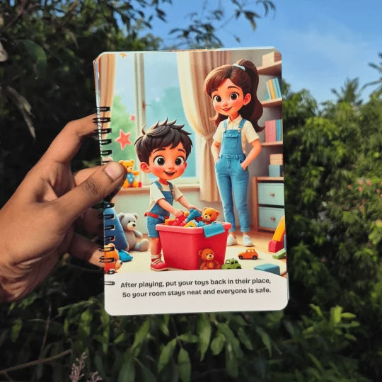 Children's book with illustrations of a boy and girl playing with toys, held by a hand against a green leafy background.